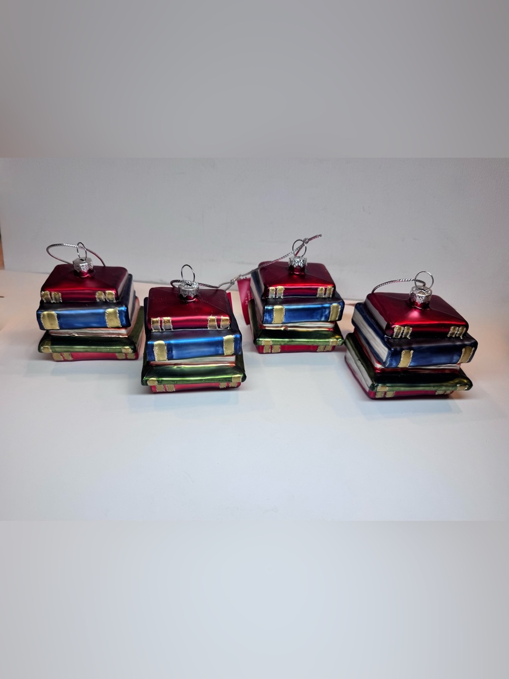 4 Pieces of Holiday Stacked Books Blown Glass Ornaments- Red, Blue, Green